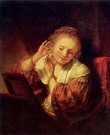 Рембрандт Харменс ван Рейн: Молодая женщина, примеривающая серьги